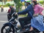 Kerap Disepelekan, Ini Bahaya Bonceng Samping Saat Naik Motor