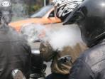 Hobi Motoran Sambil Merokok? Hati-hati Segini Denda yang Harus Dibayar