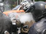 Awas, Merokok Saat Mengendarai Motor Bisa Kena Denda 
