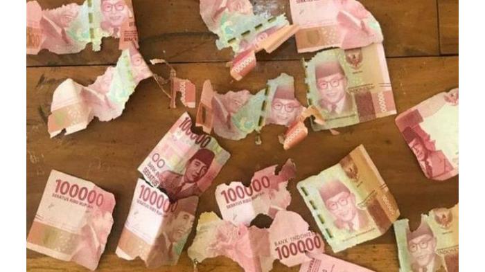 Ilustrasi Uang Kertas yang Rusak.