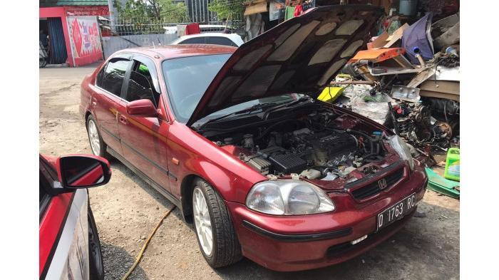 Ilustrasi mengganti komponen kendaraan setelah terendam banjir. (Kompas.com)