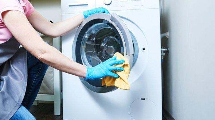 Ilustrasi membersihkan mesin cuci. (Kompas.com)