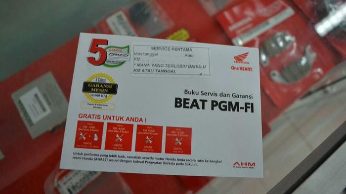 Ilustrasi buku garansi dan buku servis motor honda. (gridoto.com)